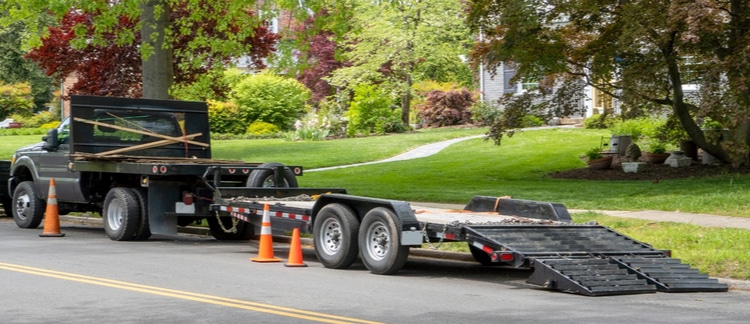 Truck and landscaping trailer at jobsite